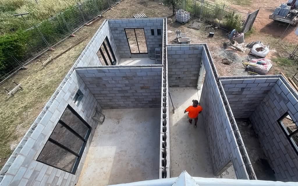 Aerial of a block home under construction with walls up, on an acreage block near Bees Creek.